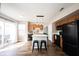 Bright kitchen features a center island with bar seating, wood cabinetry, and stainless steel appliances at 14153 Jasmine Ct, Fishers, IN 46038