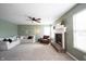 Inviting living room with a fireplace, plush carpet, and a cozy seating area at 14153 Jasmine Ct, Fishers, IN 46038