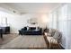Spacious living room with a staircase, modern decor, and beautiful hardwood floors at 14153 Jasmine Ct, Fishers, IN 46038