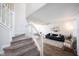 Cozy living room with a staircase, modern decor, wooden floors, and ample natural light at 14153 Jasmine Ct, Fishers, IN 46038