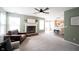 Open living room with a fireplace, flowing into the kitchen with barstool seating at 14153 Jasmine Ct, Fishers, IN 46038