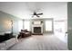 Spacious living room featuring a fireplace, plush carpet and lots of natural light at 14153 Jasmine Ct, Fishers, IN 46038
