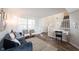Inviting living room with modern furniture, hardwood floors, neutral color palette, and natural light at 14153 Jasmine Ct, Fishers, IN 46038