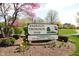 Community park sign with blooming flowers and lush greenery, promoting outdoor recreation at 14153 Jasmine Ct, Fishers, IN 46038