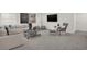 Finished basement featuring modern decor, a gray sofa, and neutral carpet at 15400 Manderley St, Fishers, IN 46040