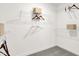 Efficient walk-in closet with wire shelving, hanging rods, and neutral colors at 15400 Manderley St, Fishers, IN 46040