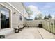 Relaxing back patio with neutral siding, fenced-in yard, outdoor furniture, and a sliding glass door at 162 Carmelaire Dr, Carmel, IN 46032