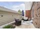 Cozy back patio with brick accents, comfortable seating, a patio umbrella and a private outdoor retreat at 162 Carmelaire Dr, Carmel, IN 46032