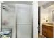 Bathroom with glass shower and dark wood vanity at 162 Carmelaire Dr, Carmel, IN 46032