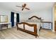 Bedroom features include wood floors, ceiling fan, light blue walls, and modern decor at 162 Carmelaire Dr, Carmel, IN 46032