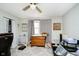 Bedroom with neutral walls and floors, featuring a dark wood dresser at 162 Carmelaire Dr, Carmel, IN 46032