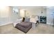 Basement bedroom with carpet, a window, and an ottoman at the end of the bed at 162 Carmelaire Dr, Carmel, IN 46032