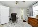 Bedroom with neutral walls, wood dresser, and a desk at 162 Carmelaire Dr, Carmel, IN 46032