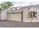 View of the attached garage with brick accents, matching the home's exterior at 162 Carmelaire Dr, Carmel, IN 46032