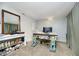Bright home office with large desk, carpeted floors, natural light, and ample room for focus and productivity at 162 Carmelaire Dr, Carmel, IN 46032