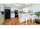 Eat-in kitchen with white cabinets, stainless steel appliances, and an island at 162 Carmelaire Dr, Carmel, IN 46032