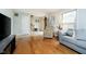Open-concept living room featuring hardwood floors and access to the foyer at 162 Carmelaire Dr, Carmel, IN 46032