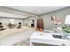 Open-concept basement design features a stylish office area that flows into a cozy living space and wet bar at 16457 Gleneagles Ct, Noblesville, IN 46060