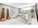 Comfortable finished basement includes a bright office area with cozy seating, a modern desk, and ample lighting at 16457 Gleneagles Ct, Noblesville, IN 46060
