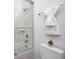 Stylish bathroom with glass-enclosed shower, white tiling, and sleek chrome fixtures offers a spa-like experience at 16457 Gleneagles Ct, Noblesville, IN 46060