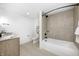 Modern bathroom features a tub, shower, and vanity with sleek black fixtures and bright lighting at 16457 Gleneagles Ct, Noblesville, IN 46060
