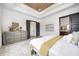 This bedroom features a tray ceiling, many windows, and a lovely gray upholstered headboard at 16457 Gleneagles Ct, Noblesville, IN 46060