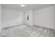 Bright, empty bedroom features neutral walls, soft carpeting, and ample natural light at 16457 Gleneagles Ct, Noblesville, IN 46060