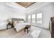Bright bedroom boasts a wooden ceiling, plush carpet, and large windows for natural light at 16457 Gleneagles Ct, Noblesville, IN 46060