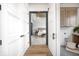 View into a beautifully decorated bedroom through sliding barn doors, with hardwood floors and modern fixtures at 16457 Gleneagles Ct, Noblesville, IN 46060