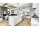 Bright, open kitchen with stainless steel appliances, large island, with a view to the living area at 16457 Gleneagles Ct, Noblesville, IN 46060