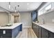 Stylish kitchen area featuring sleek cabinetry, marble countertops, and modern fixtures at 16457 Gleneagles Ct, Noblesville, IN 46060