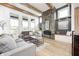 Stylish living room with a modern fireplace, comfortable seating, and bright natural light at 16457 Gleneagles Ct, Noblesville, IN 46060