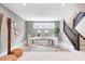 Bright home office featuring dual desks, ample lighting, and easy access to the staircase at 16457 Gleneagles Ct, Noblesville, IN 46060