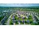 Bird's-eye view of a sprawling neighborhood with single-Gathering homes, community amenities, and a tranquil pond at 1662 Cascade Dr, Greenwood, IN 46143