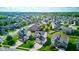 Overview of a quiet residential area featuring green spaces, manicured lawns, and diverse architectural styles of homes at 1662 Cascade Dr, Greenwood, IN 46143