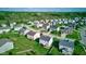 Attractive aerial shot of a residential area with neatly arranged houses, green lawns, and tree coverage at 1662 Cascade Dr, Greenwood, IN 46143