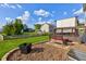 Spacious backyard features a well-maintained lawn, privacy fence, and a patio with seating at 1662 Cascade Dr, Greenwood, IN 46143