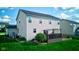 The backyard offers a wooden deck and a green lawn, creating a relaxing outdoor space for Gathering and friends at 1662 Cascade Dr, Greenwood, IN 46143