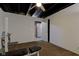 Finished basement space perfect as a home gym and features a ceiling fan at 1662 Cascade Dr, Greenwood, IN 46143