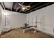 Finished basement space perfect as a home gym and features a ceiling fan at 1662 Cascade Dr, Greenwood, IN 46143