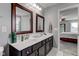 Bathroom featuring a double sink vanity with framed mirrors, cabinets, and decor at 1662 Cascade Dr, Greenwood, IN 46143