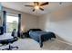 Bedroom with a ceiling fan, carpet, a computer desk and a window with curtains at 1662 Cascade Dr, Greenwood, IN 46143