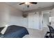 Bedroom with a ceiling fan, a TV, and a closet with sliding doors at 1662 Cascade Dr, Greenwood, IN 46143