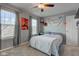 This bedroom boasts natural light, a fan, and closet for ample storage and comfort at 1662 Cascade Dr, Greenwood, IN 46143