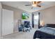 Bedroom featuring a computer desk, TV, ceiling fan, window with curtains, and closet at 1662 Cascade Dr, Greenwood, IN 46143