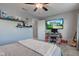 This bedroom boasts natural light, a fan, and closet for ample storage and comfort at 1662 Cascade Dr, Greenwood, IN 46143