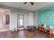 Bonus room with a wood floor, exercise equipment, a ceiling fan and a wall tapestry at 1662 Cascade Dr, Greenwood, IN 46143