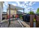 Relaxing covered deck features patio furniture, a grill, and plenty of space for entertaining at 1662 Cascade Dr, Greenwood, IN 46143