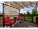 Cozy covered deck area with comfortable seating and string lights for evening enjoyment at 1662 Cascade Dr, Greenwood, IN 46143