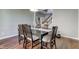 Dining room with dark wood table set and view of the home's front entrance at 1662 Cascade Dr, Greenwood, IN 46143